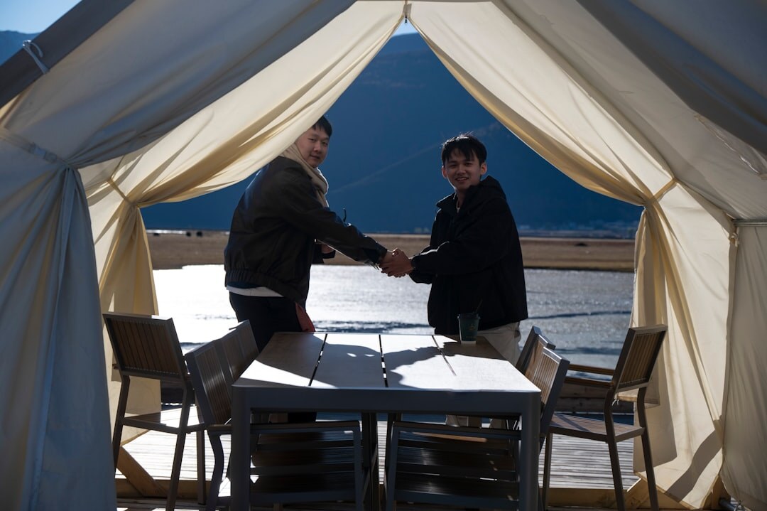Business handshake between two partners in an office